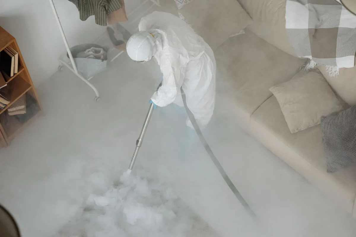 Biohazard cleanup technician in protective equipment, Chesilhurst, NJ